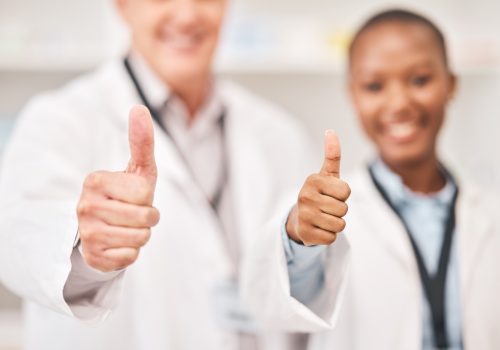 pharmacist-man-woman-and-thumbs-up-in-shop-retail-store-or-hospital-for-feedback-review-or-good.jpg