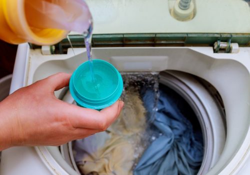 woman-hand-pouring-washing-powder-into-the-washing-machine-washing-powder-into-the-washing-machine.jpg